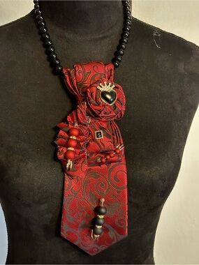 Handcrafted Red Swirl Statement Necklace with Black Heart Accent